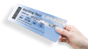 Hand of a woman holding a airplane ticket to London